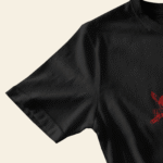flatlay tshirt mockup wooden surface closeup with sleeve and chest designs warm natural light 1808