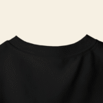 peach wall closeup t shirt mockup back neck focus on minimalist design and fabric texture 01747